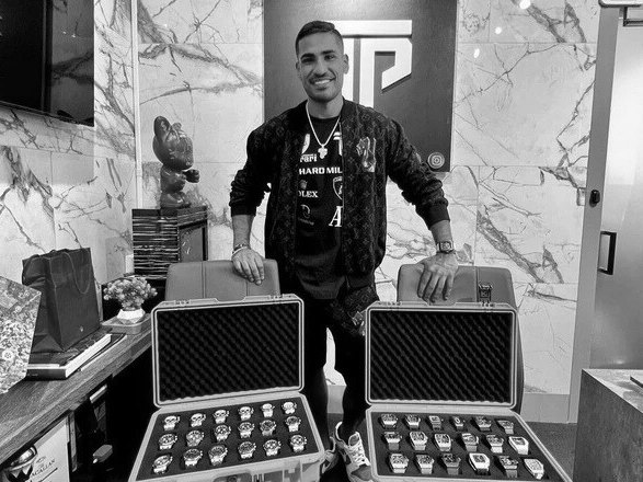 Neel Alwani with cases of watches