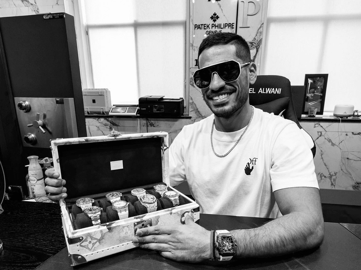 Neel Alwani with a case of luxury watches