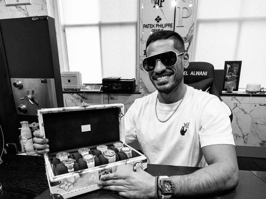 Neel Alwani with a case of watches